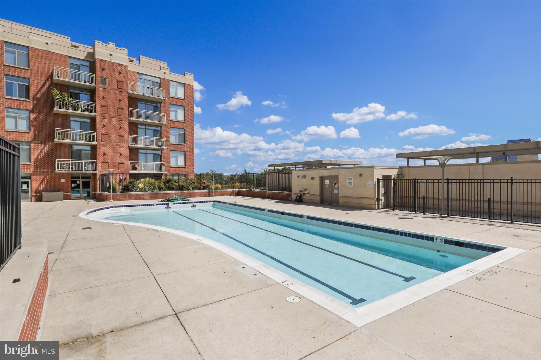 3600 South Glebe Road, Unit 414W Arlington, VA 22202 - Photo 41 of 60 a swimming pool with outdoor seating and yard
