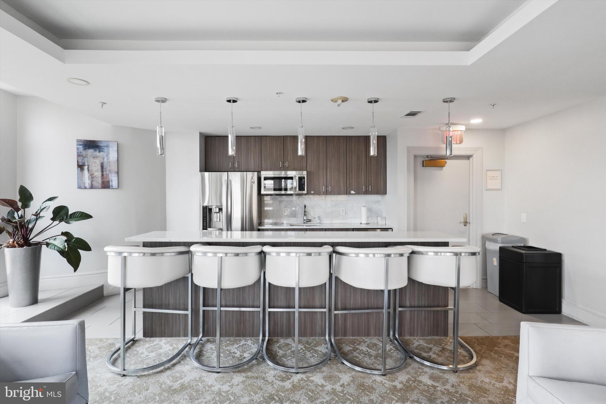 3600 South Glebe Road, Unit 414W Arlington, VA 22202 - Photo 48 of 60 a large kitchen with a table and chairs