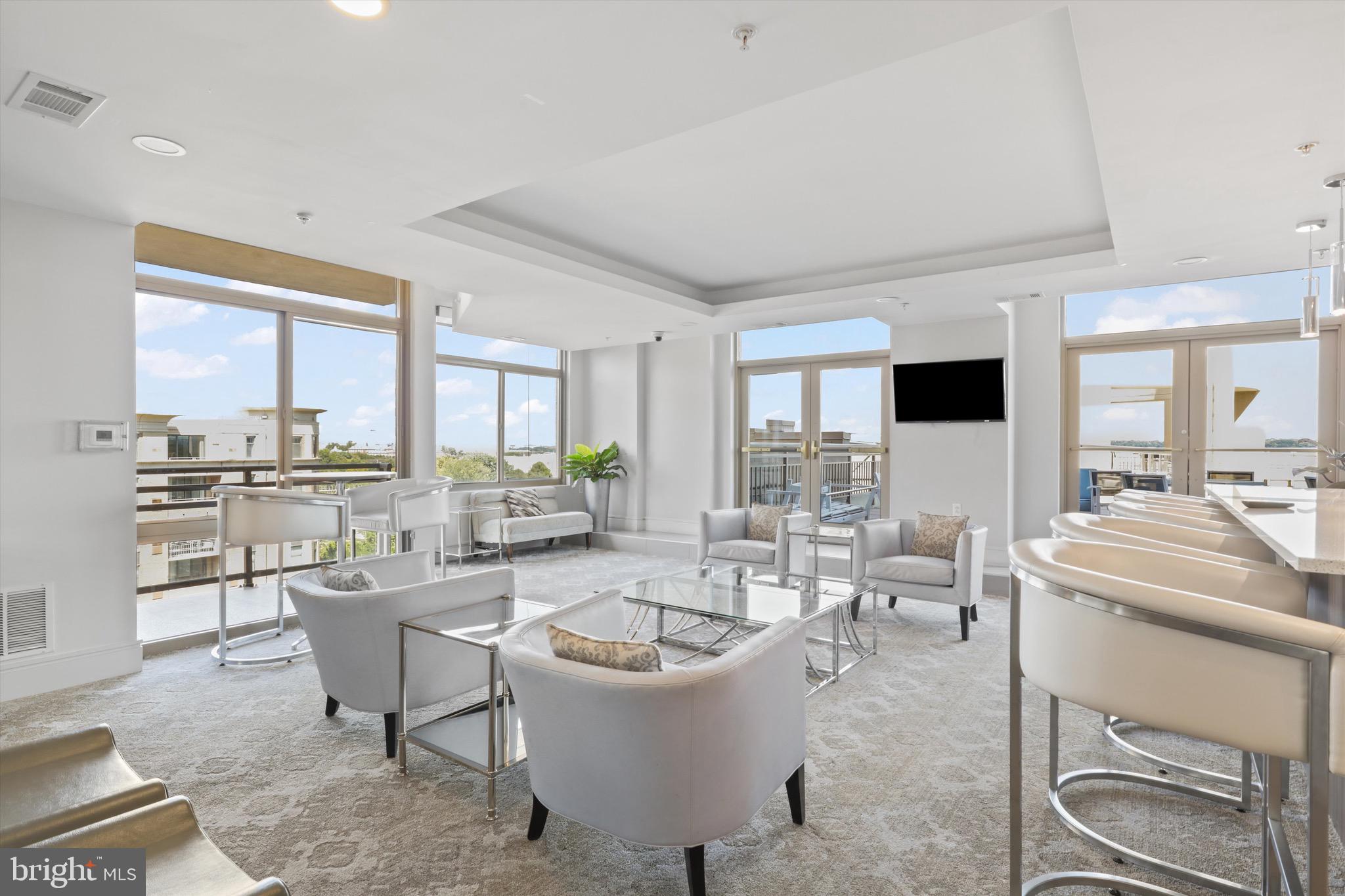 3600 South Glebe Road, Unit 414W Arlington, VA 22202 - Photo 51 of 60 a large living room with a large window and white appliances