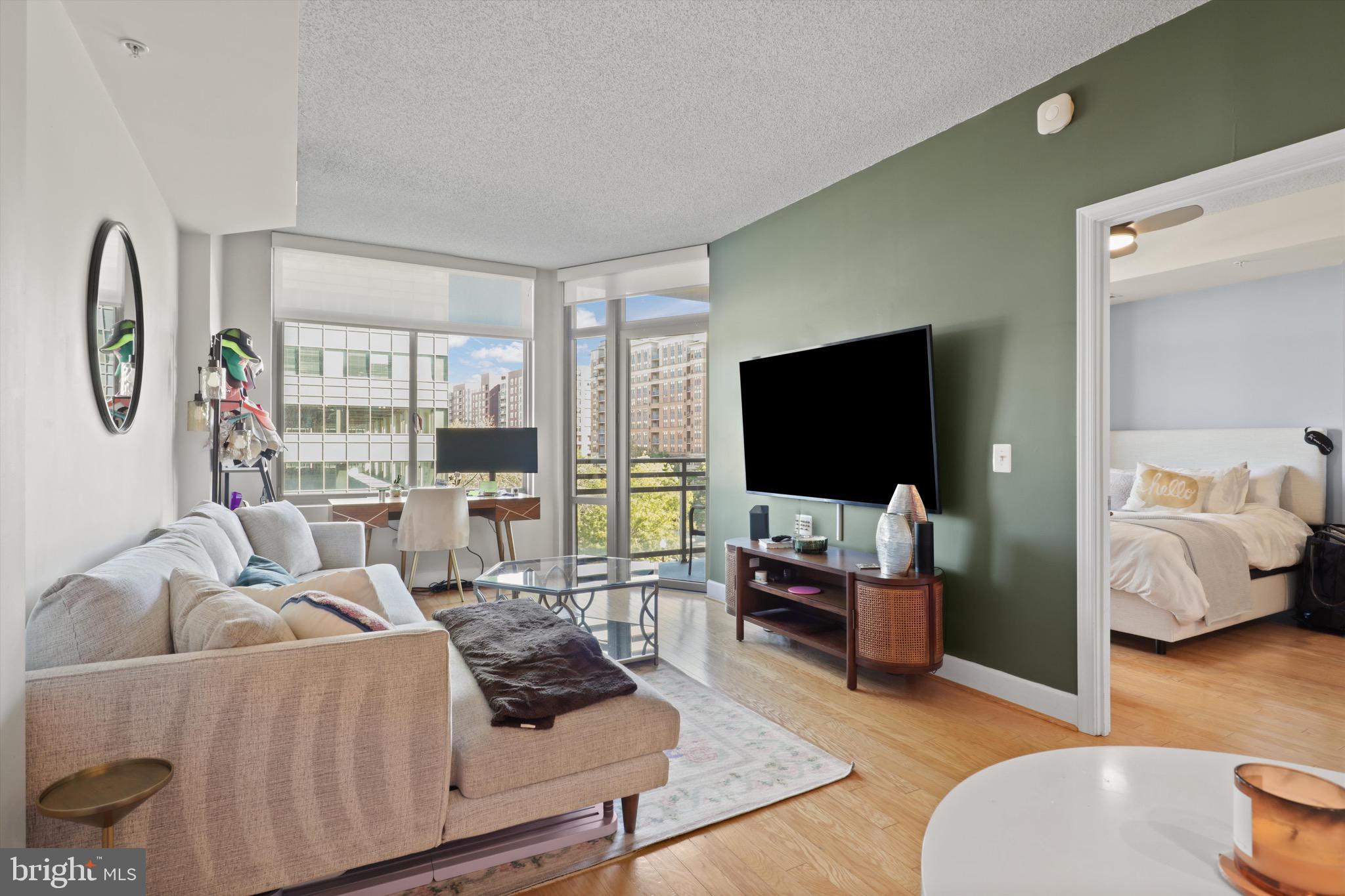 3600 South Glebe Road, Unit 414W Arlington, VA 22202 - Photo 8 of 60 a living room with furniture and a flat screen tv