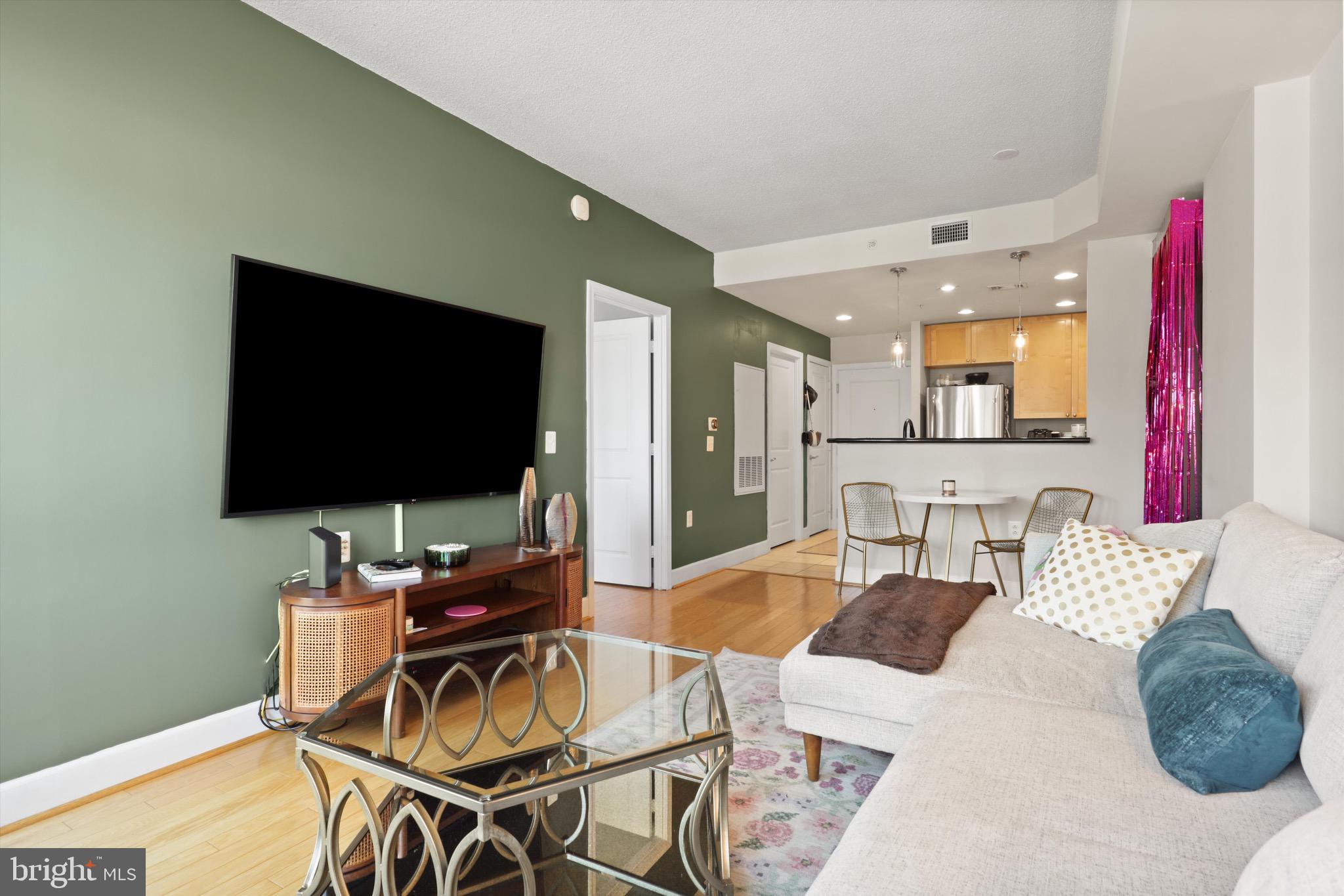 3600 South Glebe Road, Unit 414W Arlington, VA 22202 - Photo 9 of 60 a living room with furniture and a flat screen tv
