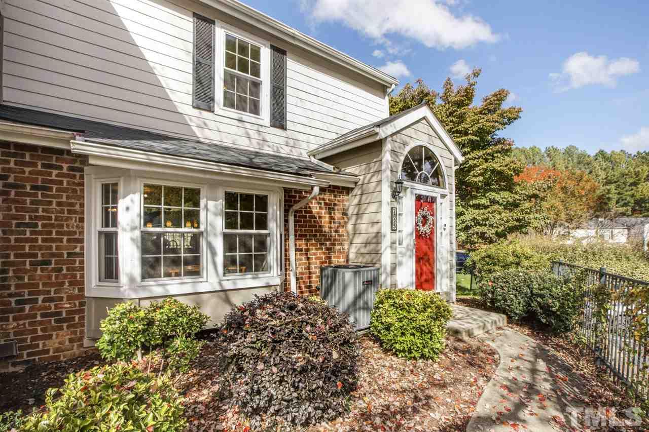 7625 Falcon Rest Circle, Unit 7625 Raleigh, NC 27615 - Photo 2 of 29 a front view of a house with a yard