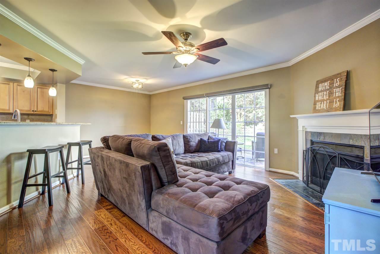 7625 Falcon Rest Circle, Unit 7625 Raleigh, NC 27615 - Photo 11 of 29 a living room with furniture and a fireplace