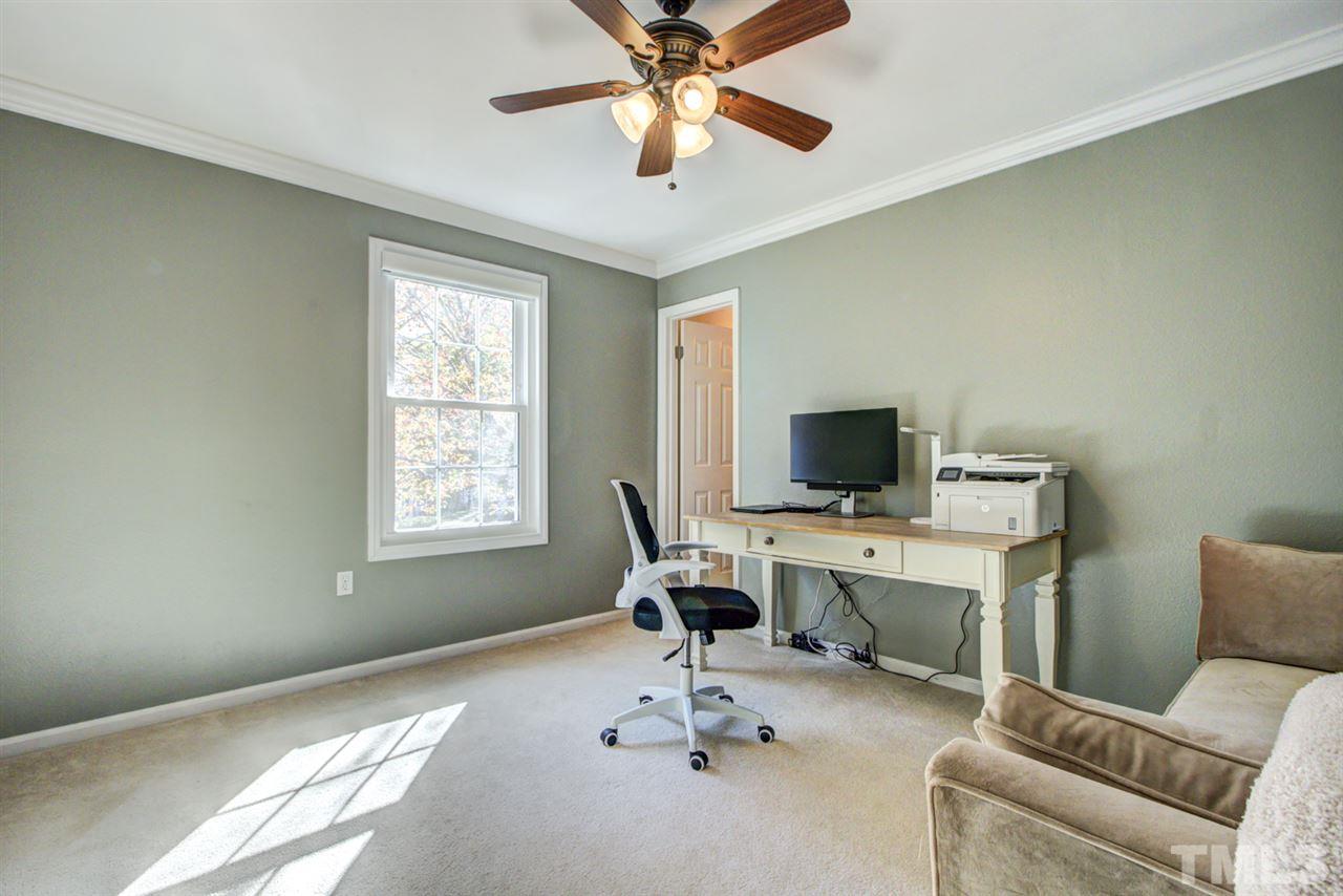 7625 Falcon Rest Circle, Unit 7625 Raleigh, NC 27615 - Photo 20 of 29 a workspace with furniture and a window