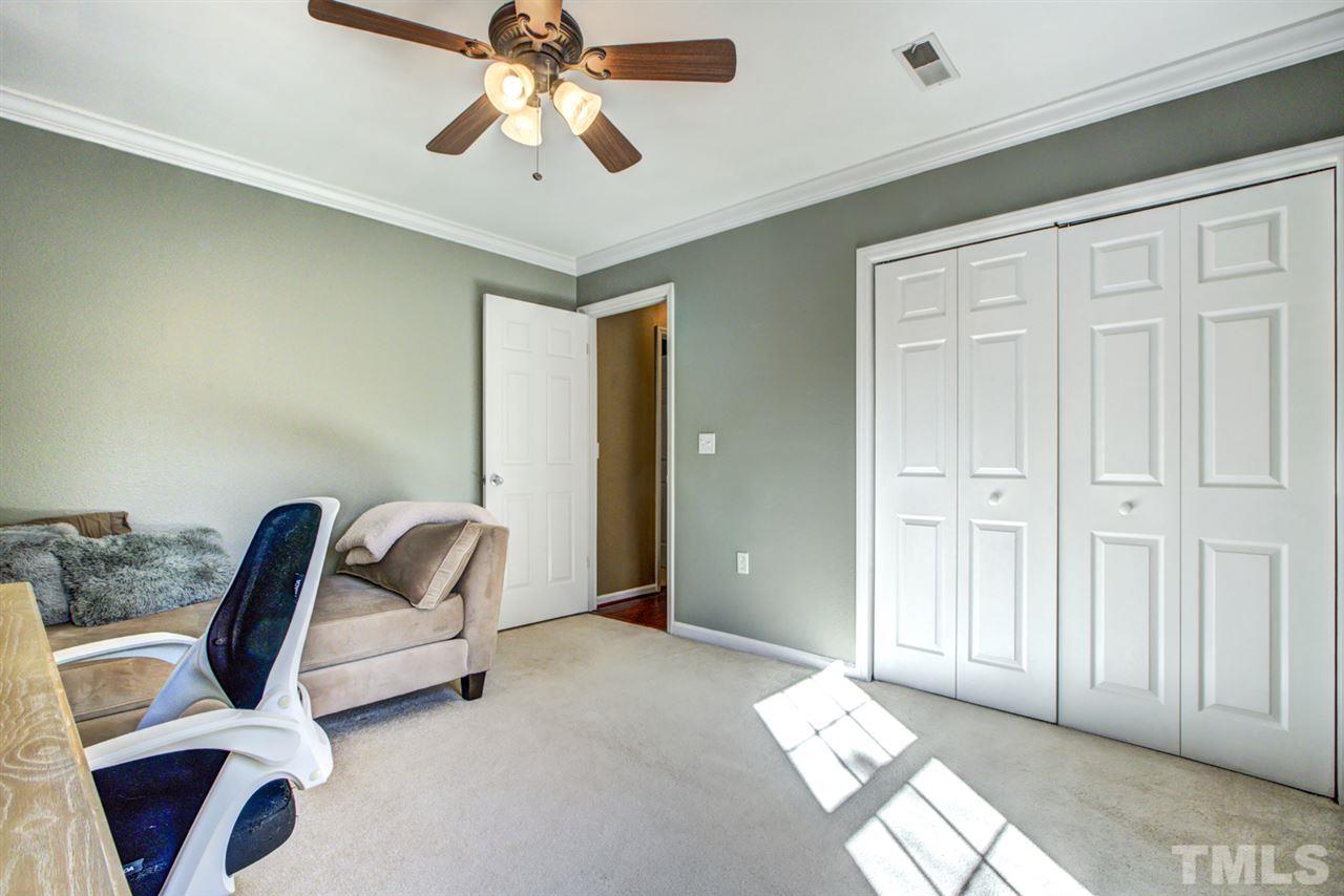 7625 Falcon Rest Circle, Unit 7625 Raleigh, NC 27615 - Photo 21 of 29 a living room with furniture and a ceiling fan