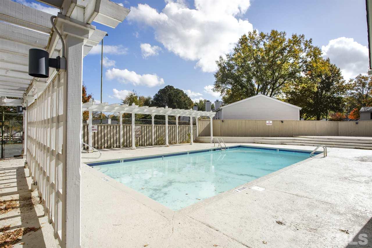 7625 Falcon Rest Circle, Unit 7625 Raleigh, NC 27615 - Photo 27 of 29 a view of a swimming pool with an outdoor space