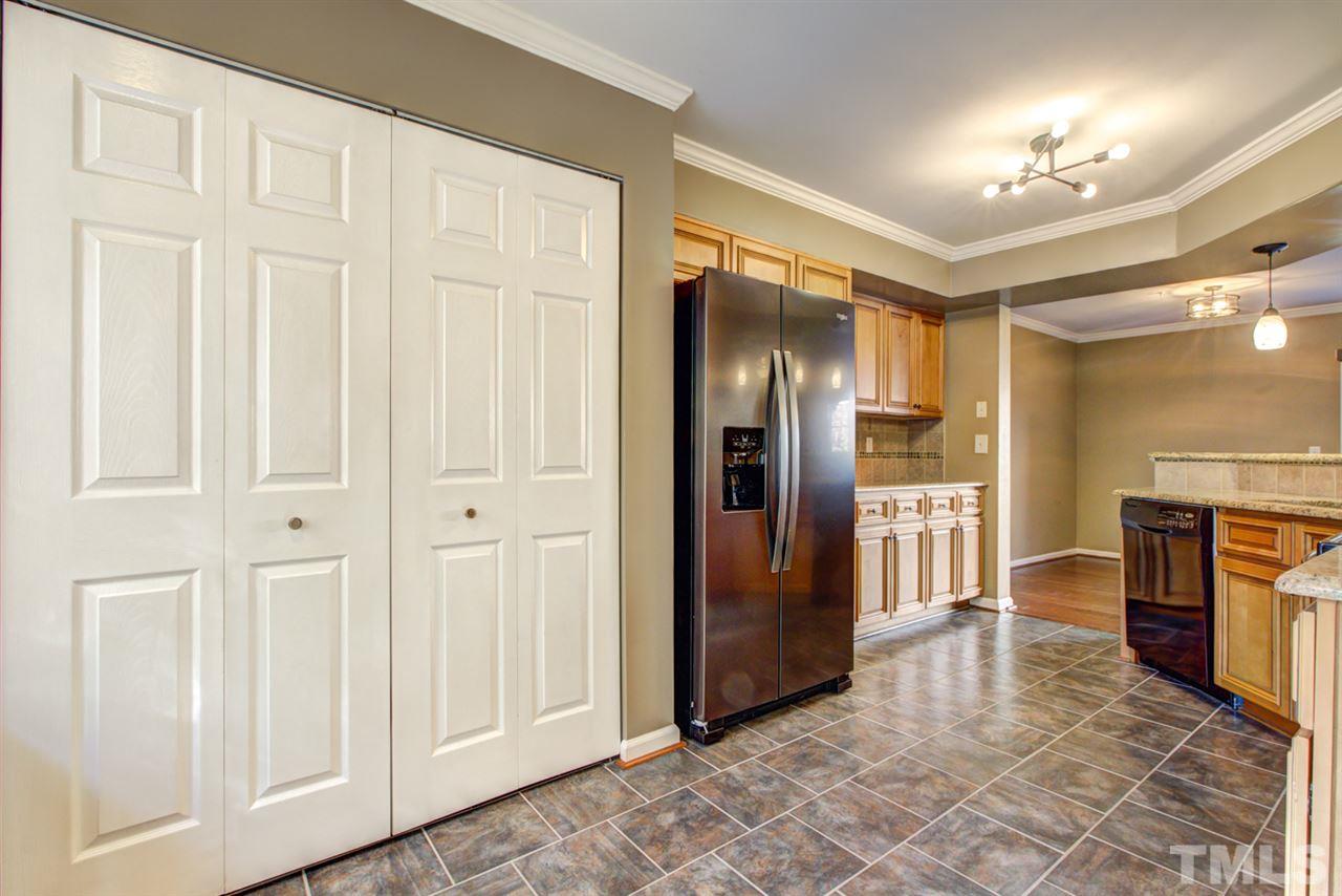 7625 Falcon Rest Circle, Unit 7625 Raleigh, NC 27615 - Photo 7 of 29 a view of a hallway with furniture and a fireplace