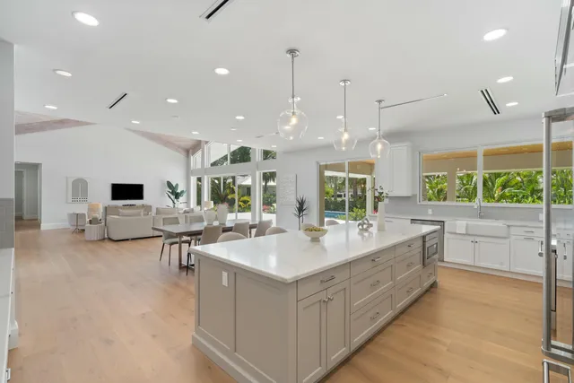 a large kitchen with a table and chairs in it