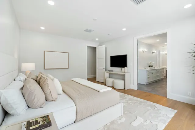 a bathroom with a double vanity sink mirror and shower