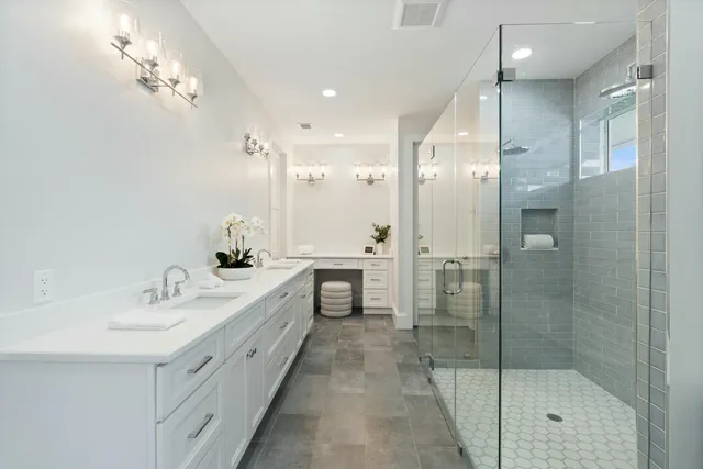 a bathroom with a shower and a sink