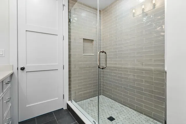 a view of an house with swimming pool and chairs