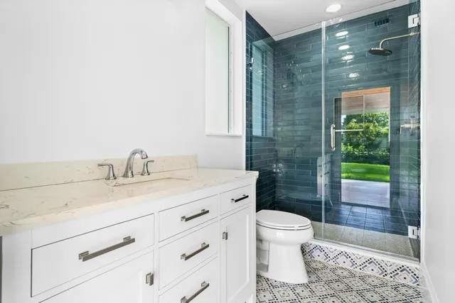 a view of a patio with table and chairs potted plants with wooden floor