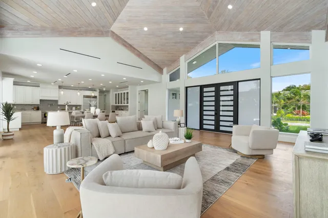 a kitchen with stainless steel appliances kitchen island granite countertop a sink and cabinets