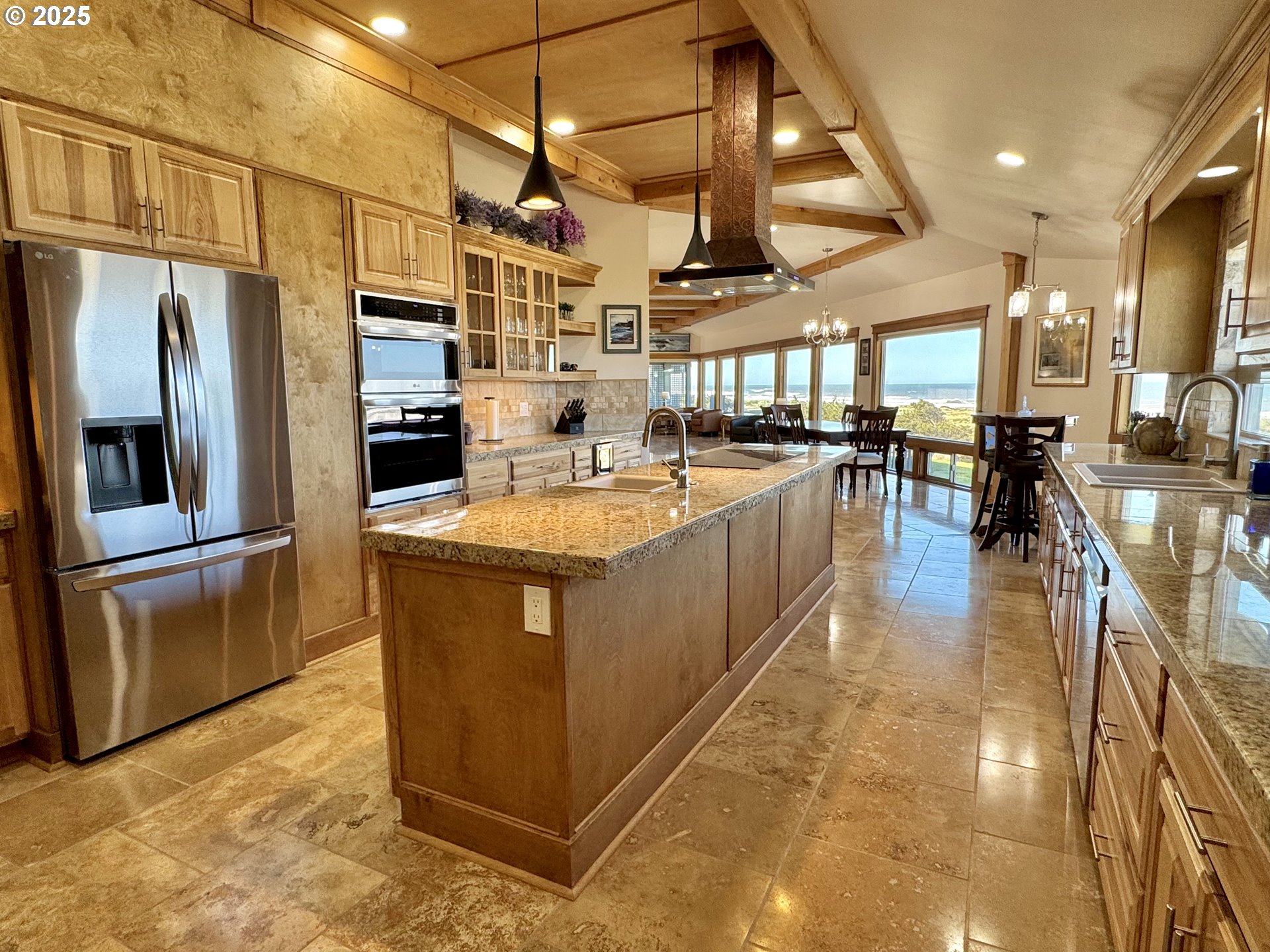 94098 Rubys Way Gold Beach, OR 97444 - Photo 13 of 48 a kitchen with stainless steel appliances granite countertop a sink a stove and a refrigerator