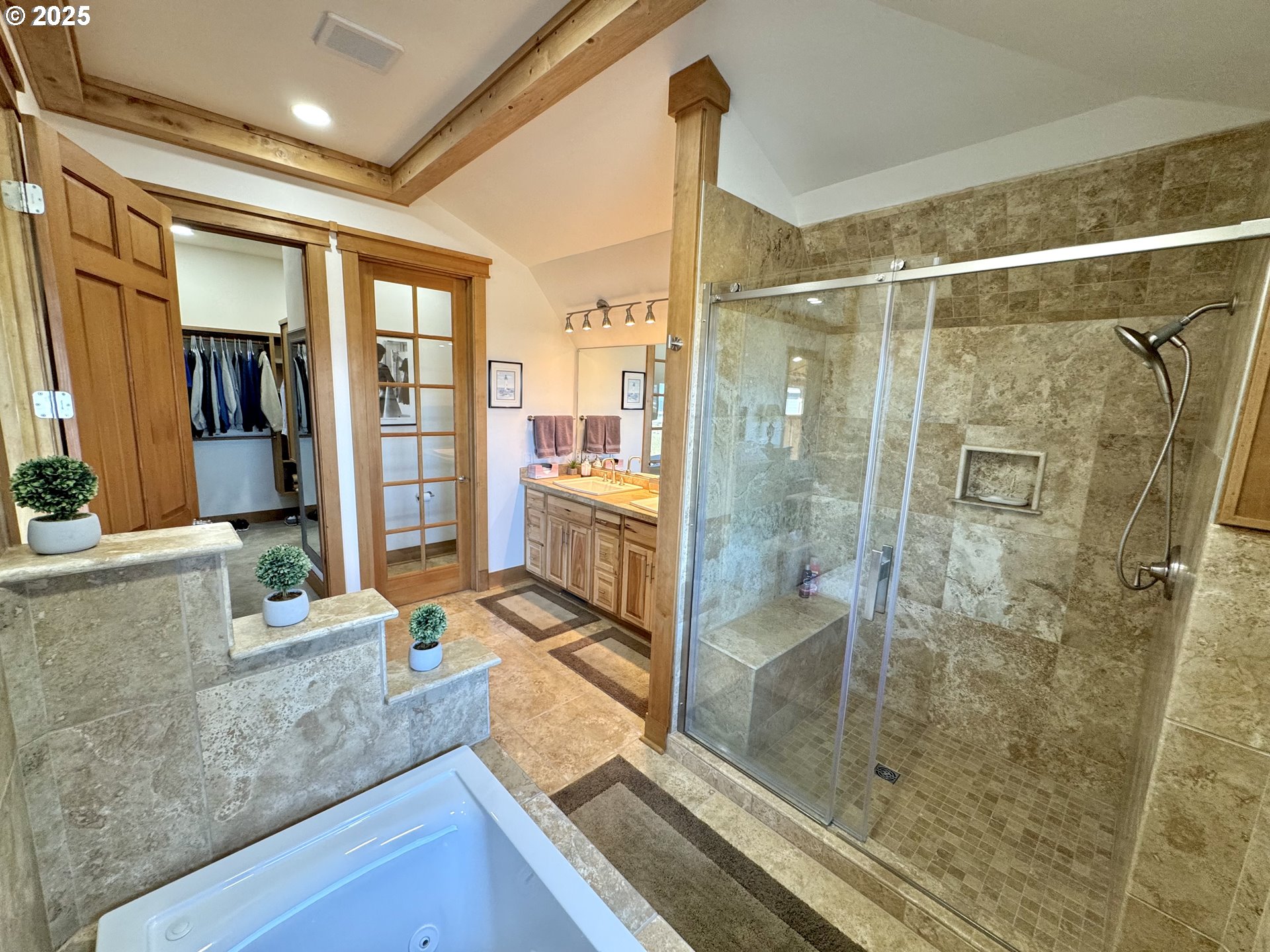 94098 Rubys Way Gold Beach, OR 97444 - Photo 17 of 48 a bathroom with a granite countertop sink a mirror and a glass door shower