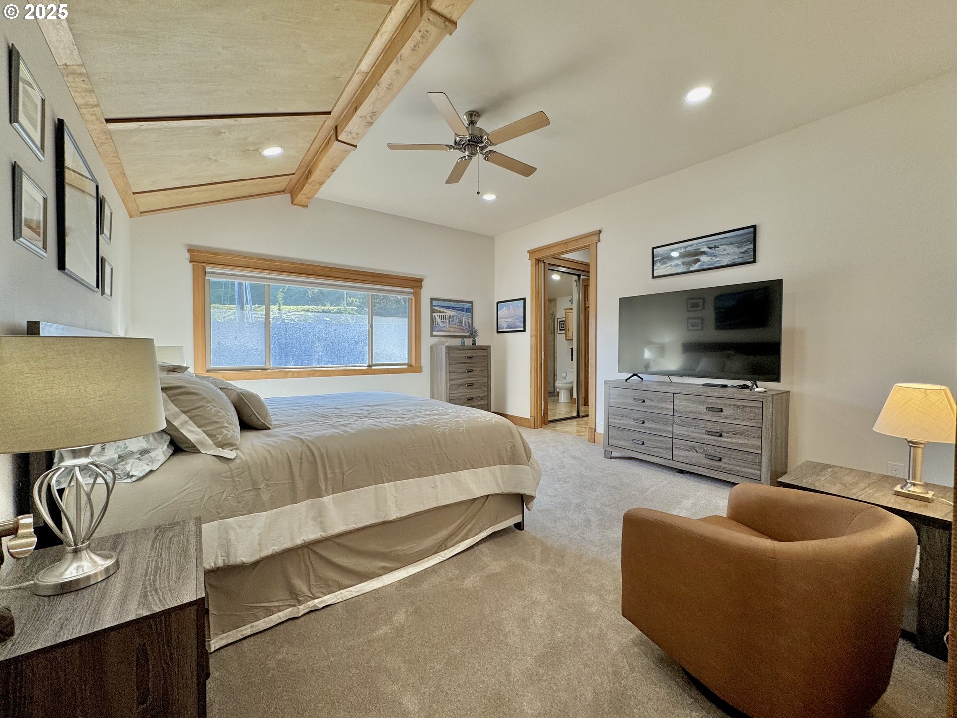 94098 Rubys Way Gold Beach, OR 97444 - Photo 21 of 48 a bedroom with furniture and a flat screen tv