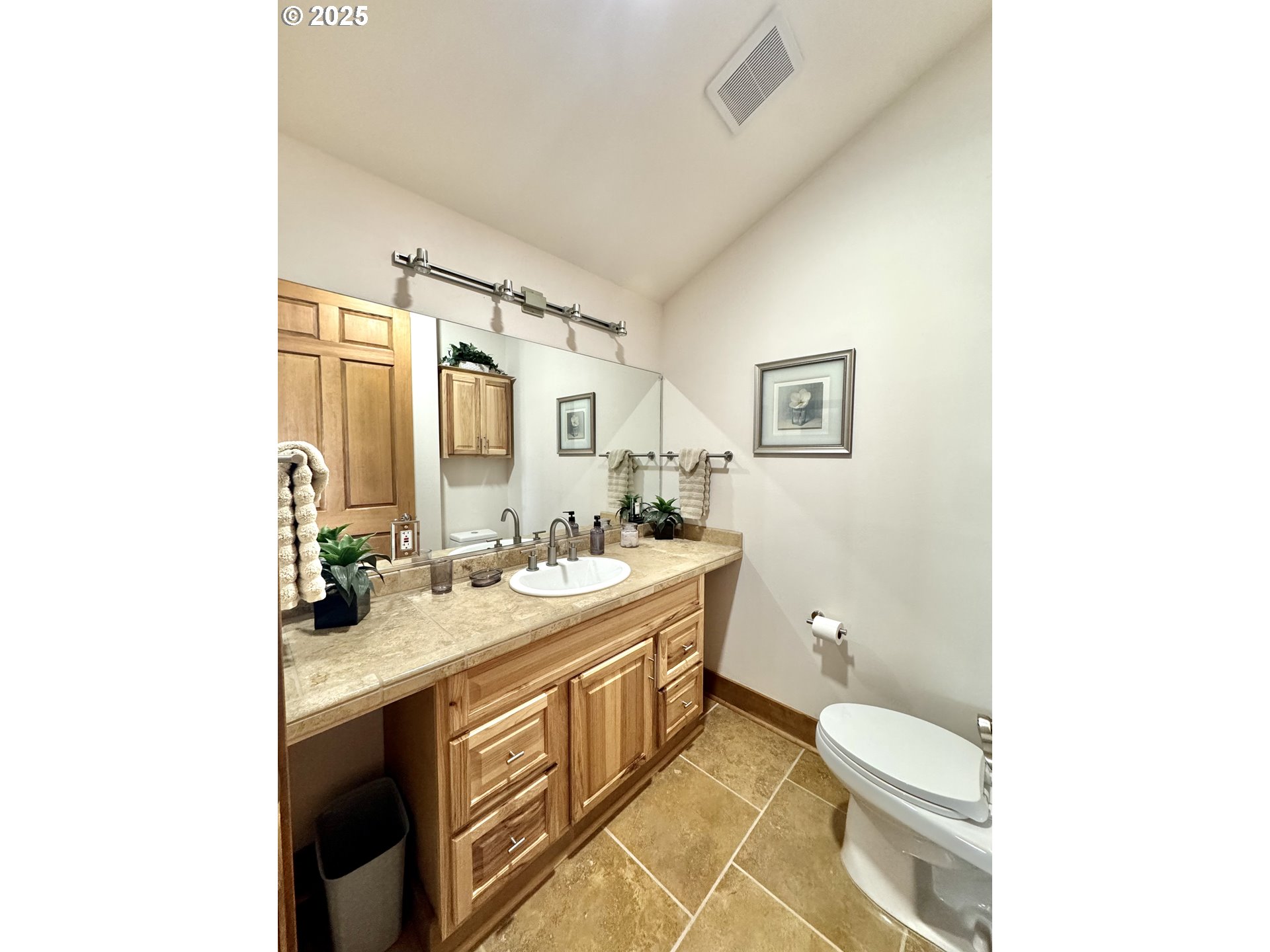 94098 Rubys Way Gold Beach, OR 97444 - Photo 26 of 48 a bathroom with a double vanity sink toilet and mirror