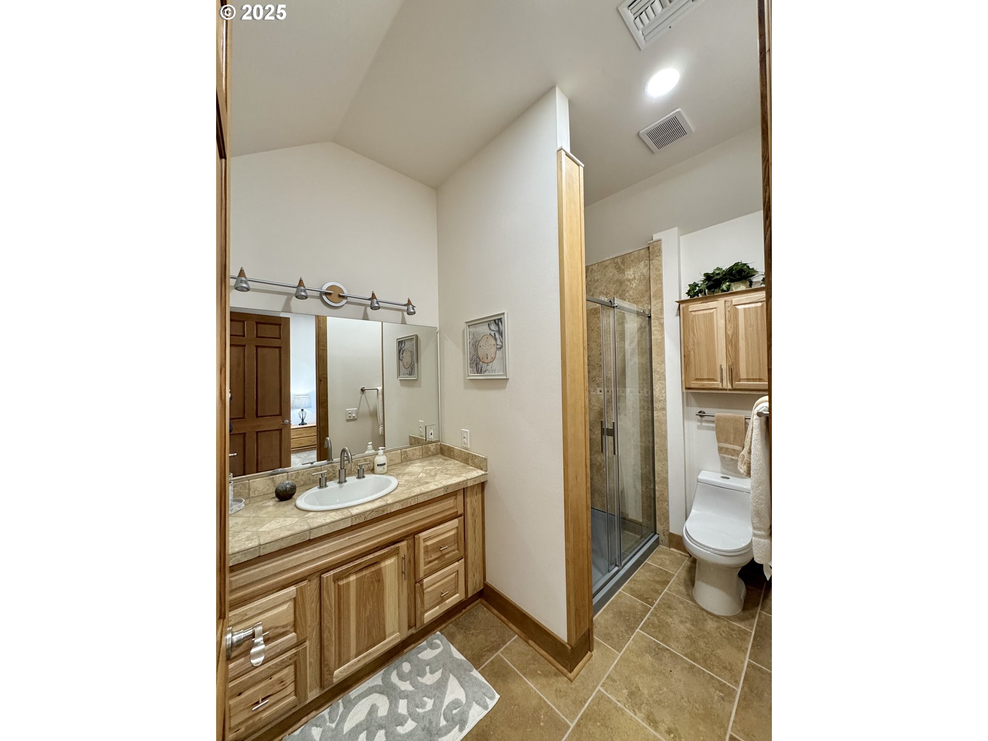 94098 Rubys Way Gold Beach, OR 97444 - Photo 28 of 48 a spacious bathroom with a double vanity sink and a mirror