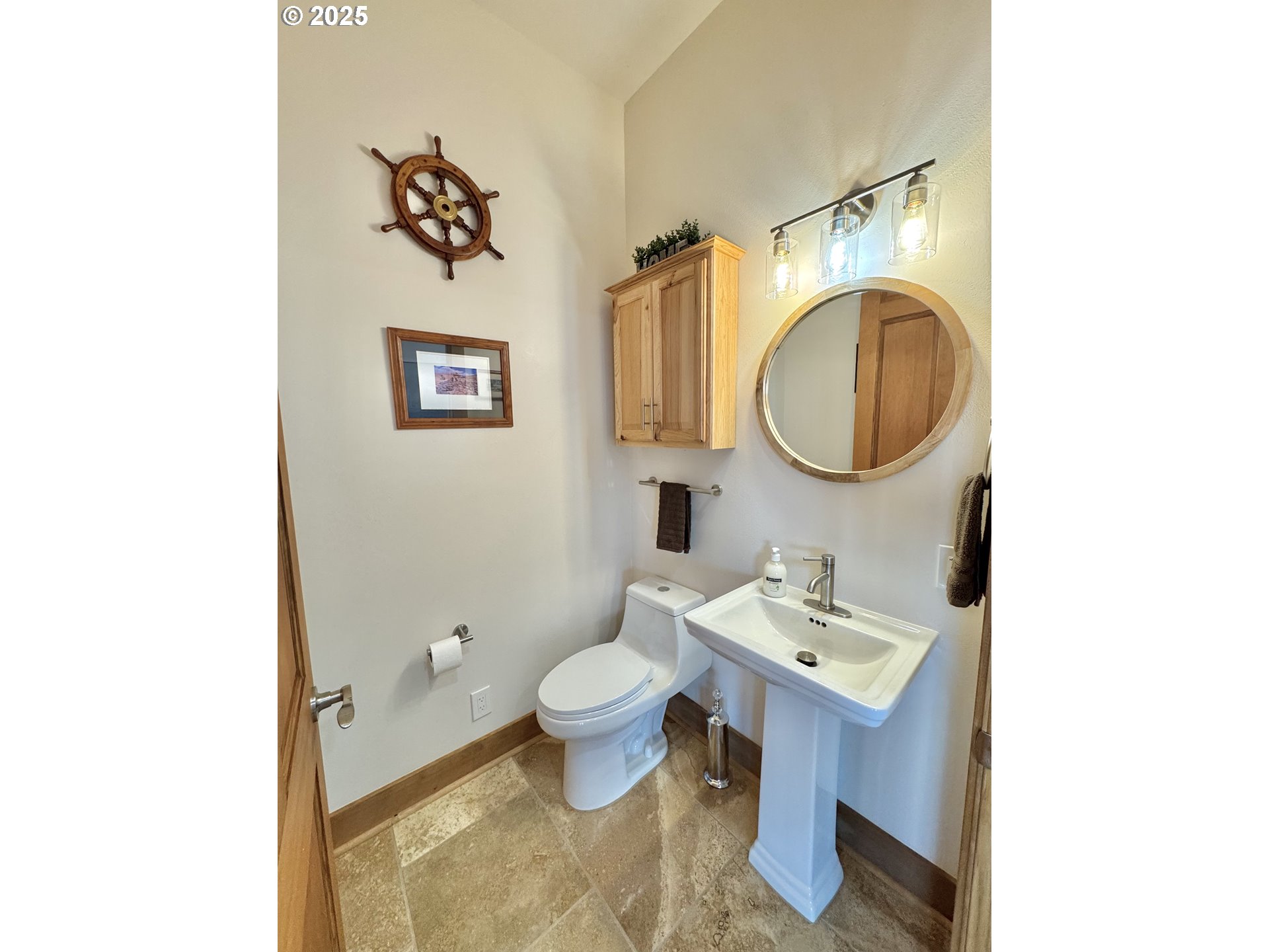 94098 Rubys Way Gold Beach, OR 97444 - Photo 30 of 48 a bathroom with a toilet sink and mirror