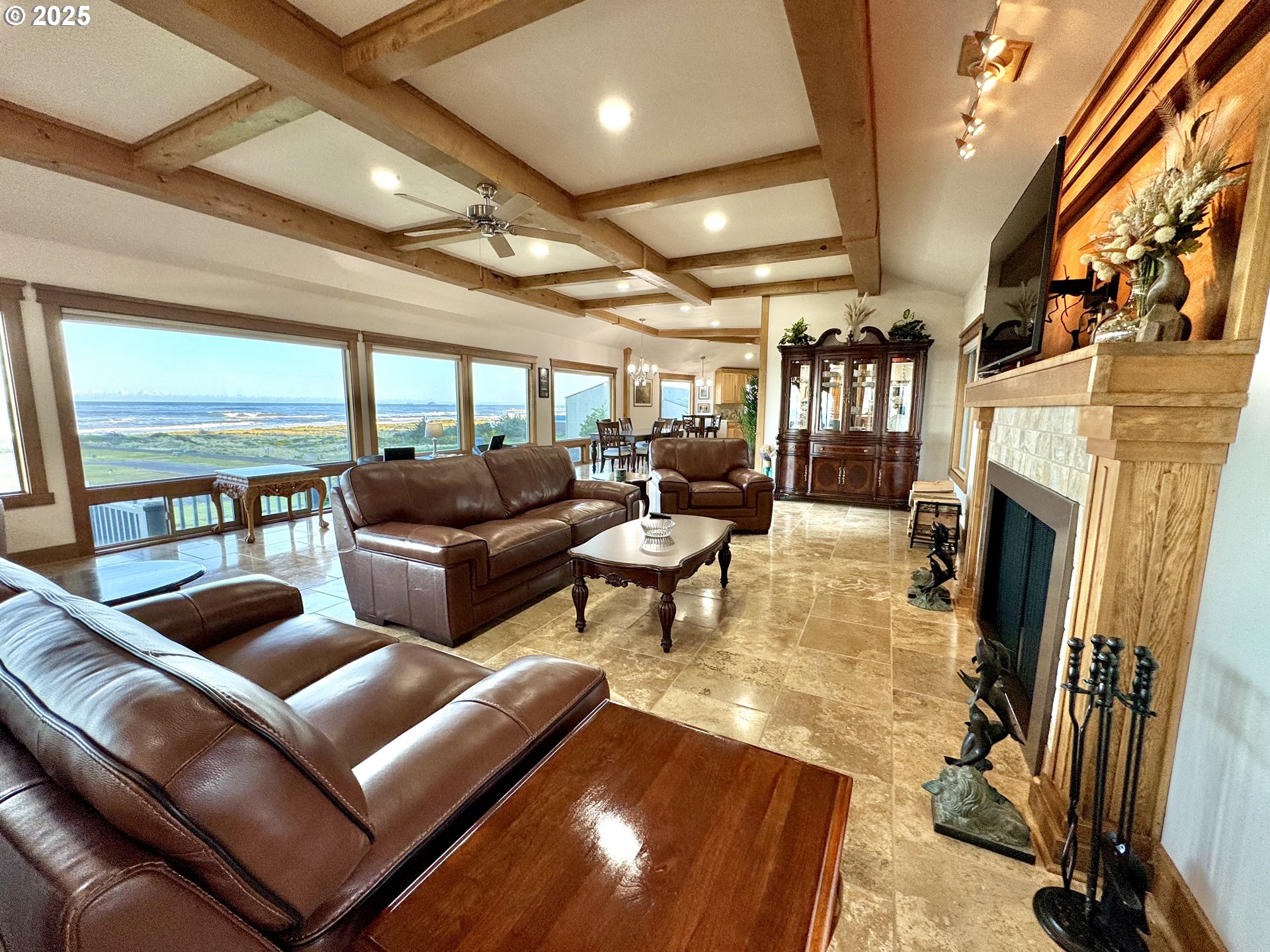 94098 Rubys Way Gold Beach, OR 97444 - Photo 8 of 48 a living room with furniture a fireplace and a flat screen tv