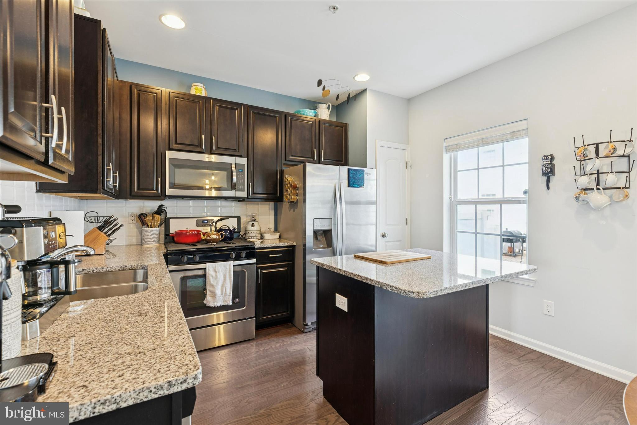 3711 Jacob Stout Road, Unit 5 Doylestown, PA 18902 - Photo 13 of 25 a kitchen with stainless steel appliances granite countertop a sink stove and refrigerator