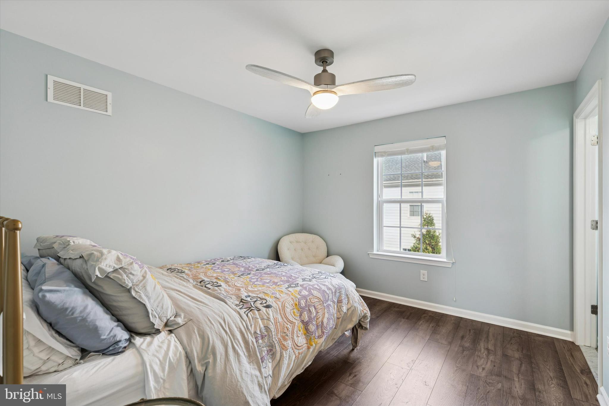 3711 Jacob Stout Road, Unit 5 Doylestown, PA 18902 - Photo 20 of 25 a bedroom with a bed and wooden floor