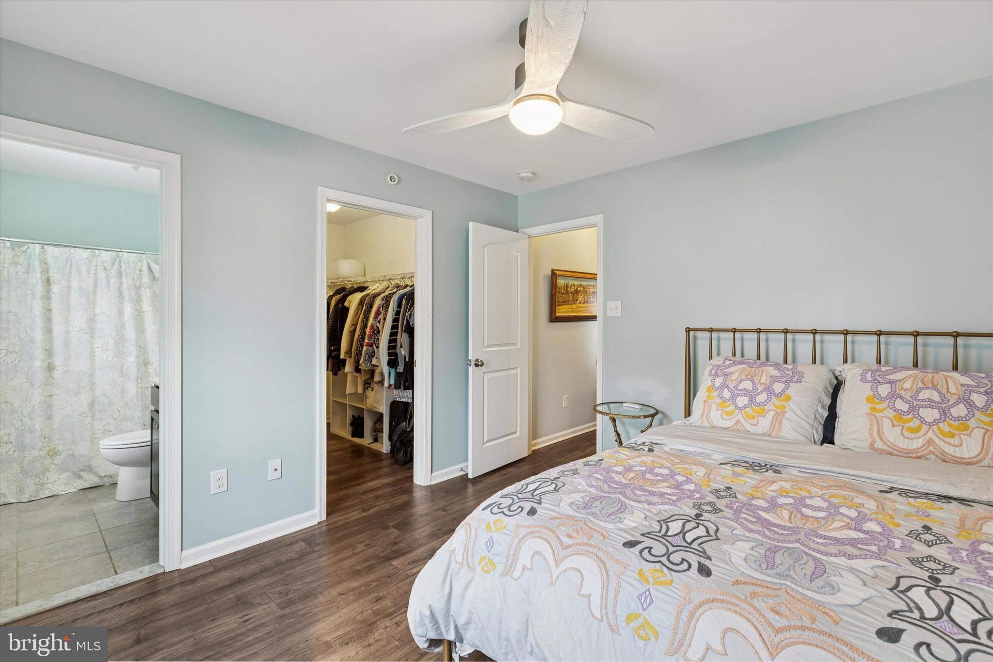 3711 Jacob Stout Road, Unit 5 Doylestown, PA 18902 - Photo 21 of 25 a bedroom with a large bed and a chandelier