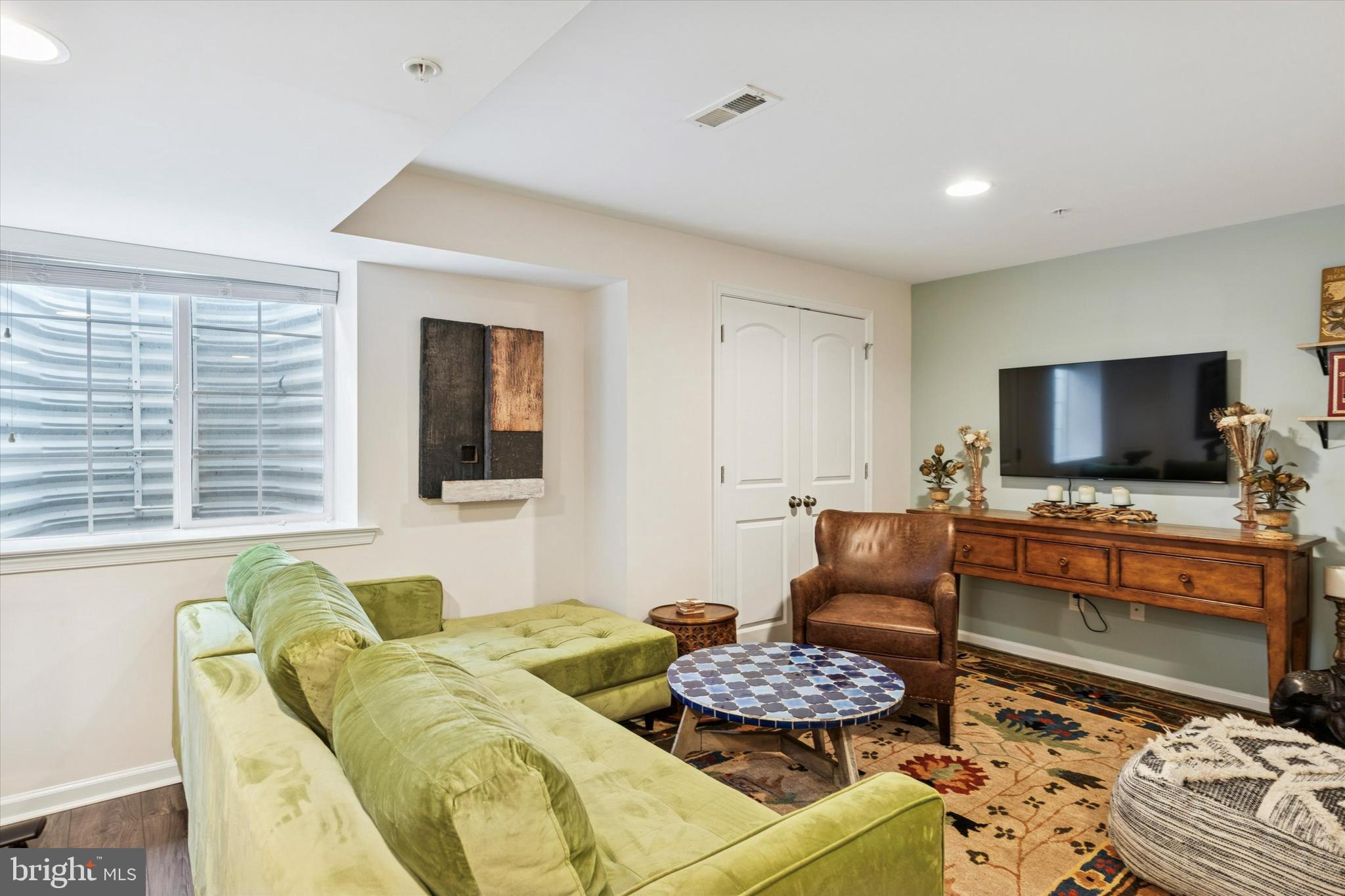 3711 Jacob Stout Road, Unit 5 Doylestown, PA 18902 - Photo 24 of 25 a living room with furniture and a flat screen tv