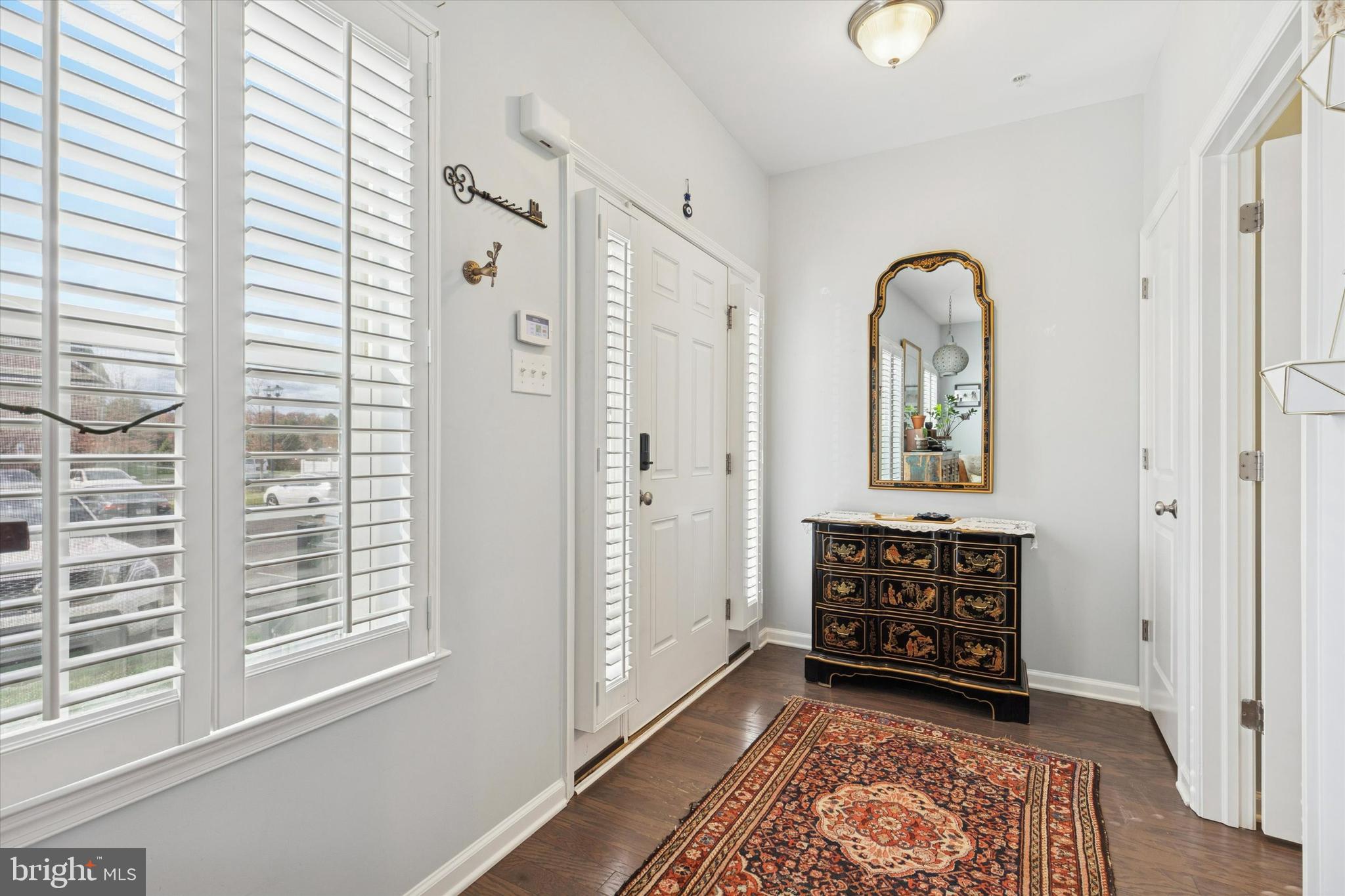 3711 Jacob Stout Road, Unit 5 Doylestown, PA 18902 - Photo 3 of 25 a view of front door with chandelier