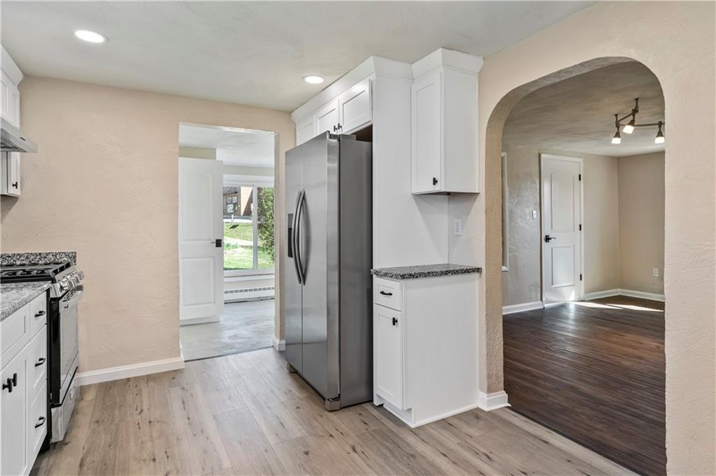 5154 North Pioneer Road Gibsonia, PA 15044 - Photo 10 of 26 Kitchen is open to Dining room and enclosed sunroom which offers a full Bath