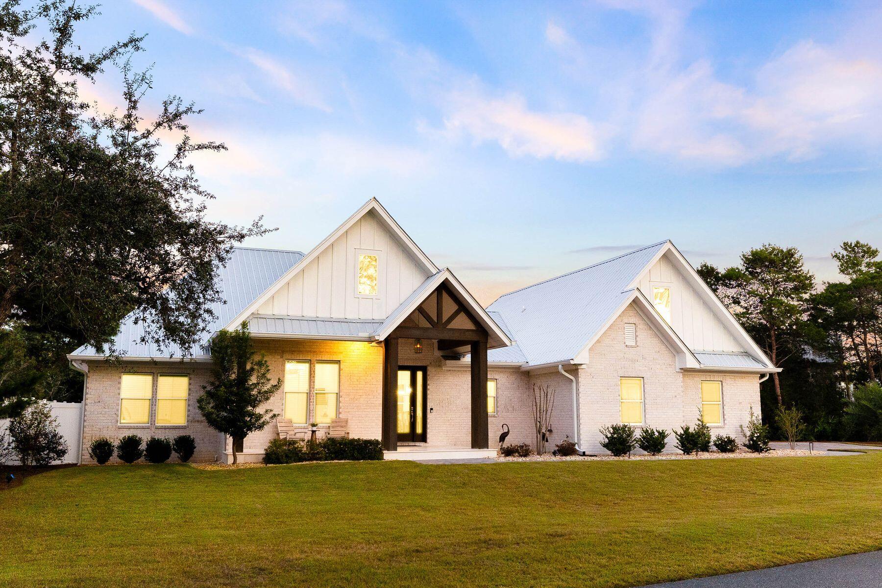 274 Ridge Road Santa Rosa Beach, FL 32459 - Photo 1 of 40 a front view of a house with a yard