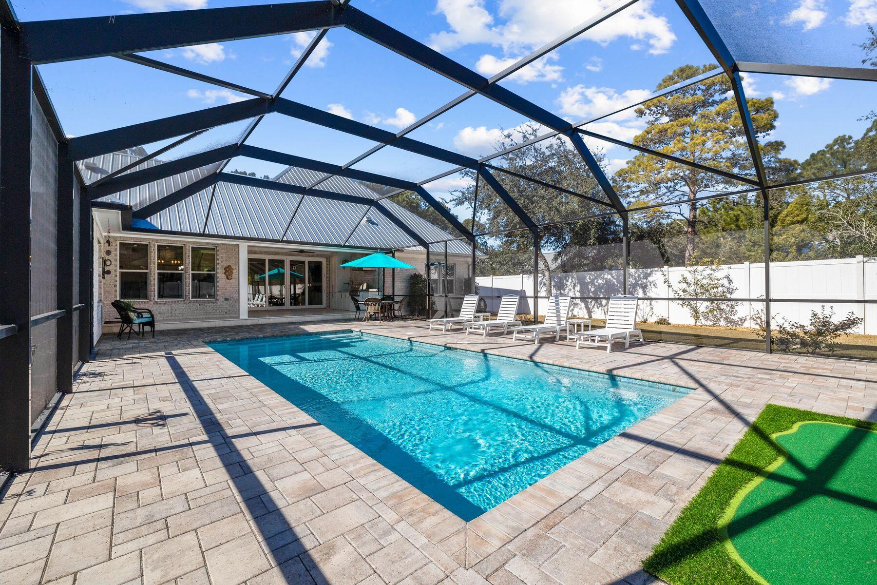 274 Ridge Road Santa Rosa Beach, FL 32459 - Photo 17 of 40 a view of a swimming pool with a patio