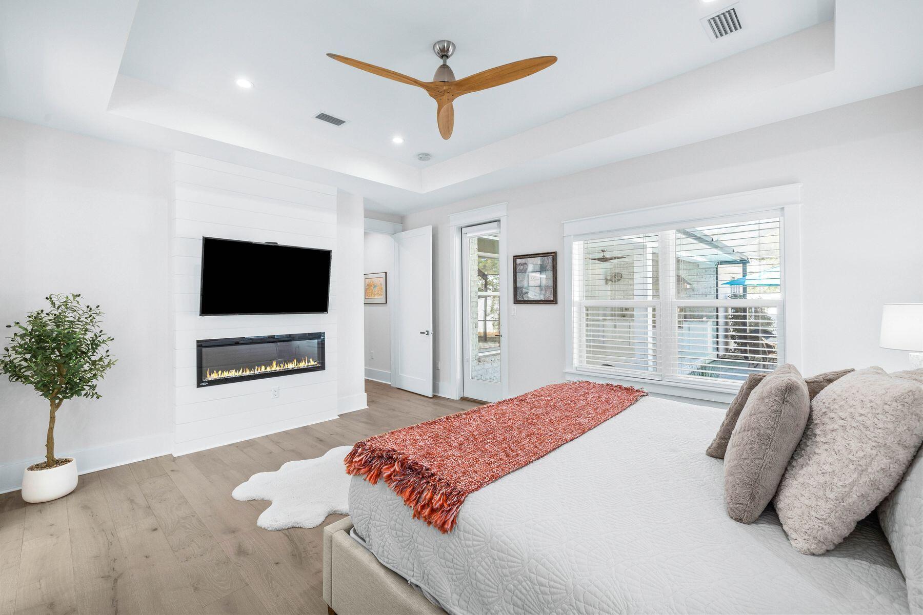 274 Ridge Road Santa Rosa Beach, FL 32459 - Photo 22 of 40 a spacious bedroom with a bed and a flat screen tv