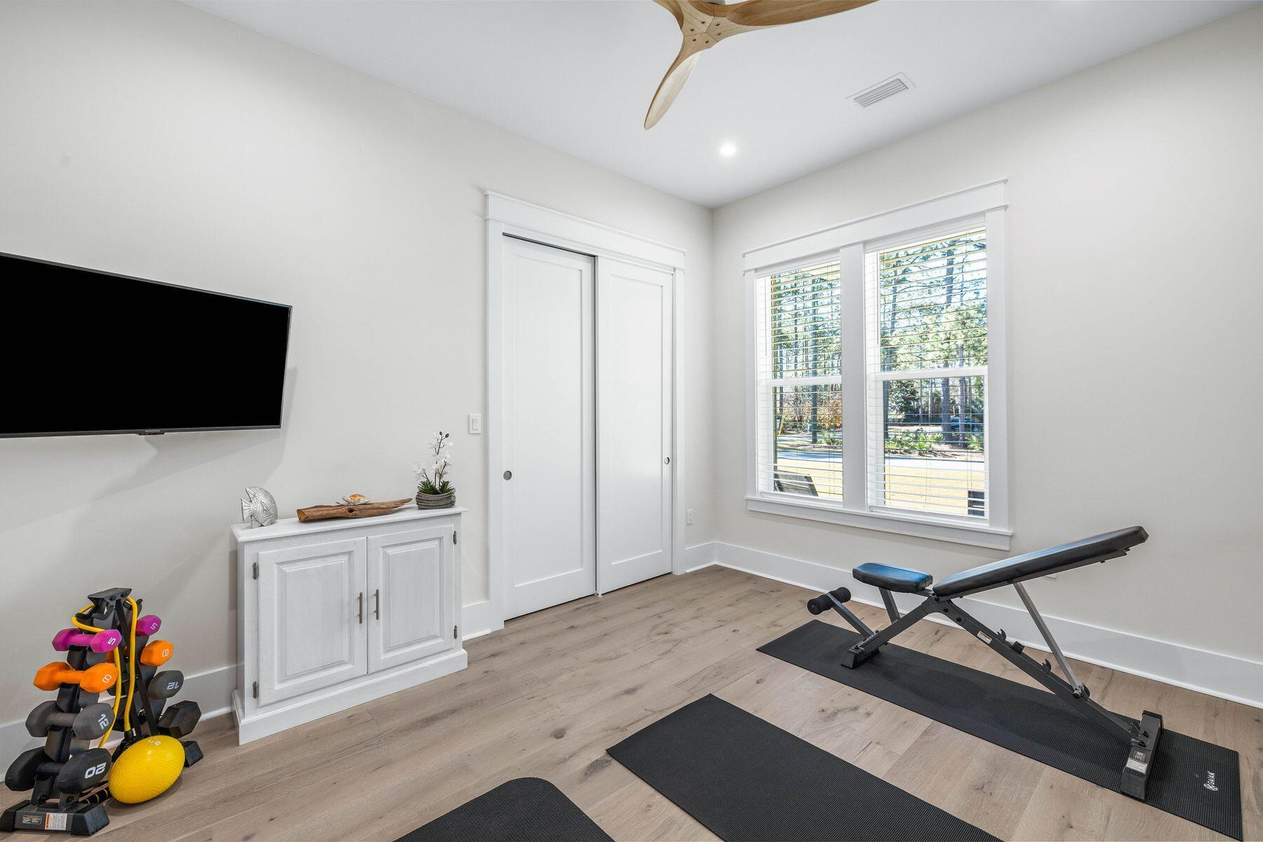 274 Ridge Road Santa Rosa Beach, FL 32459 - Photo 28 of 40 a view of a workspace with furniture and a flat screen tv