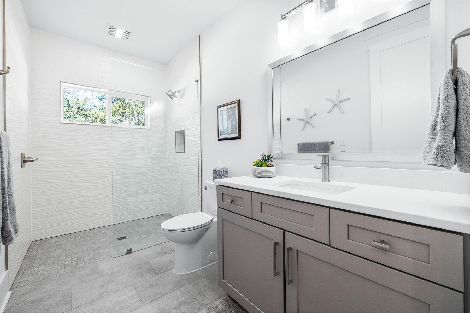 274 Ridge Road Santa Rosa Beach, FL 32459 - Photo 30 of 40 a bathroom with a sink a toilet and mirror