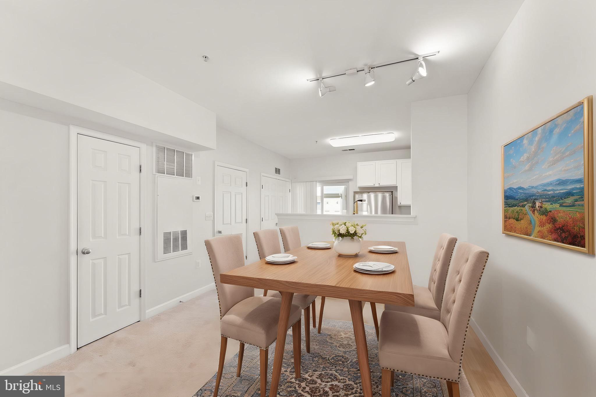 42427 Goldenseal Square Brambleton, VA 20148 - Photo 11 of 52 a view of a dining room with furniture