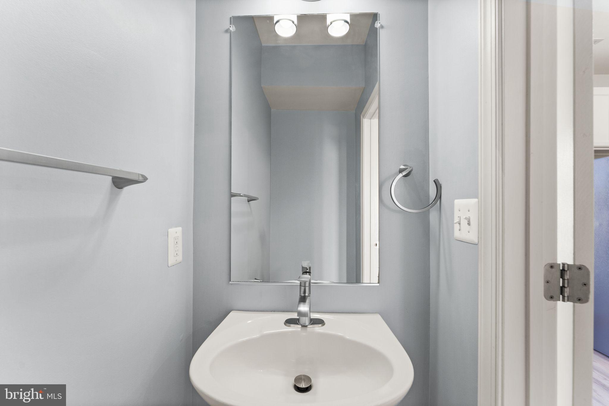 42427 Goldenseal Square Brambleton, VA 20148 - Photo 17 of 52 a bathroom with a sink and mirror