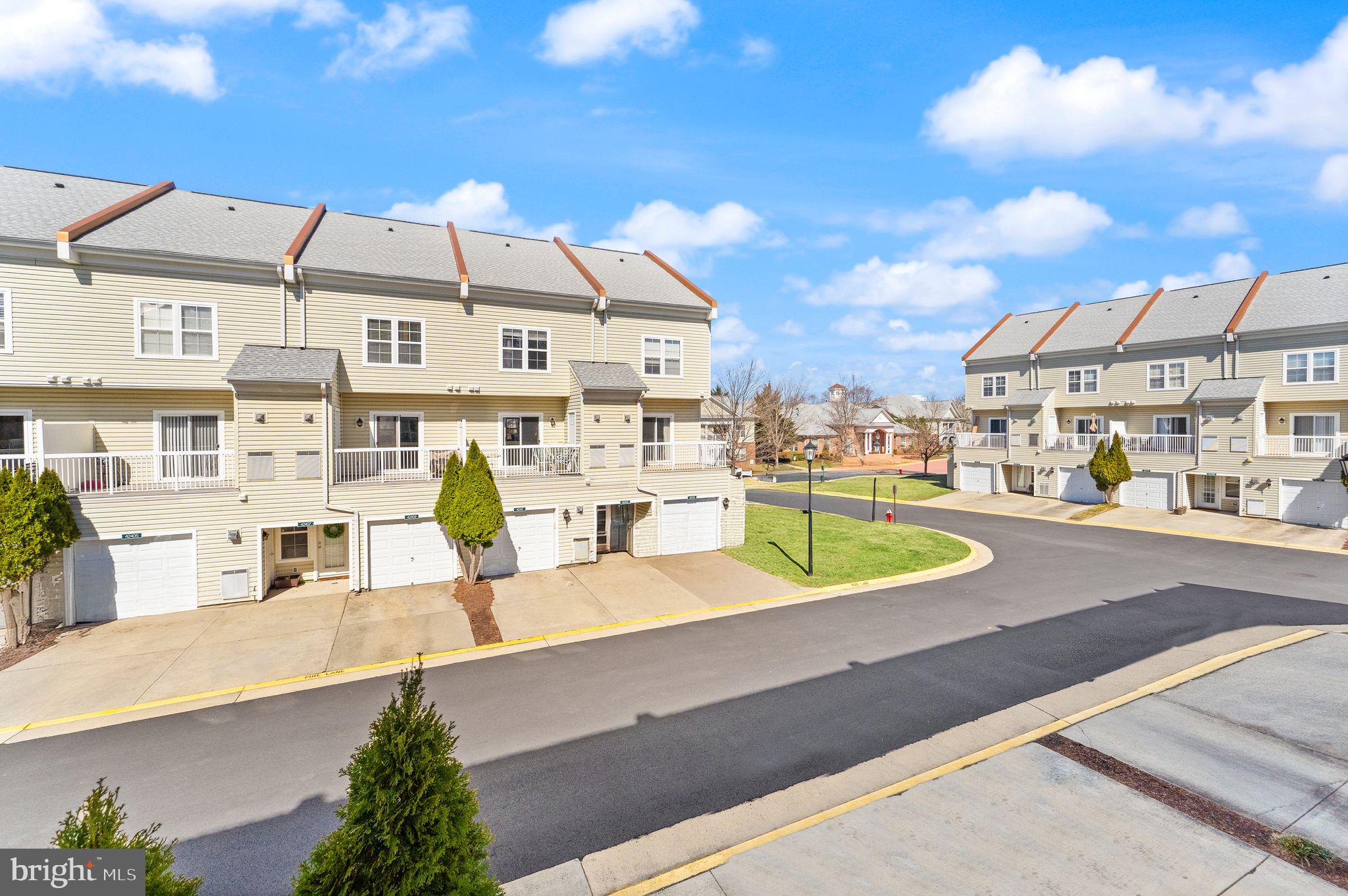 42427 Goldenseal Square Brambleton, VA 20148 - Photo 22 of 52 a view of a swimming pool with a lounge chairs