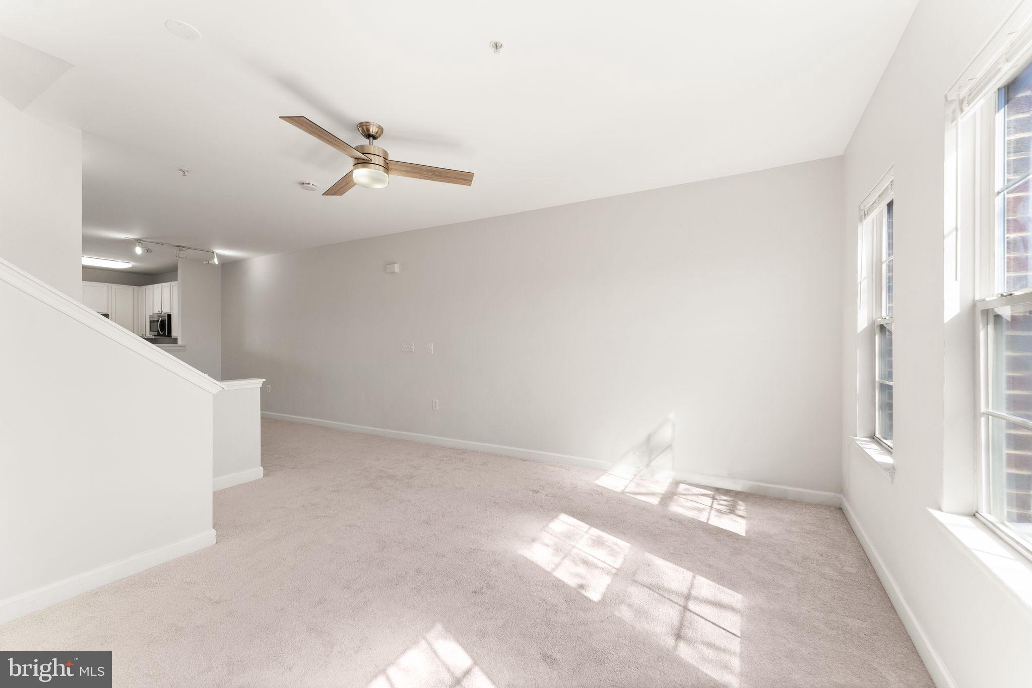 42427 Goldenseal Square Brambleton, VA 20148 - Photo 27 of 52 a view of a kitchen with a sink and wooden floor