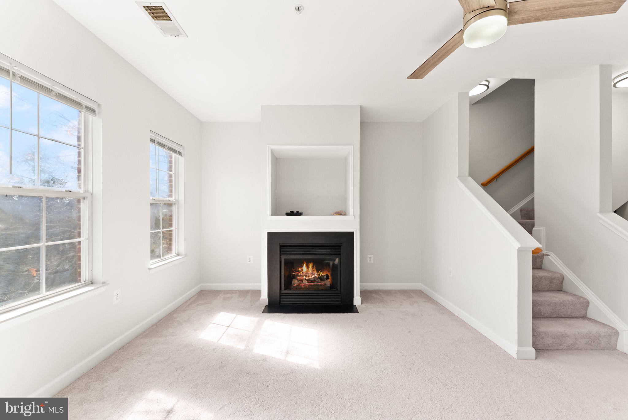 42427 Goldenseal Square Brambleton, VA 20148 - Photo 28 of 52 a view of an empty room with wooden floor and a window
