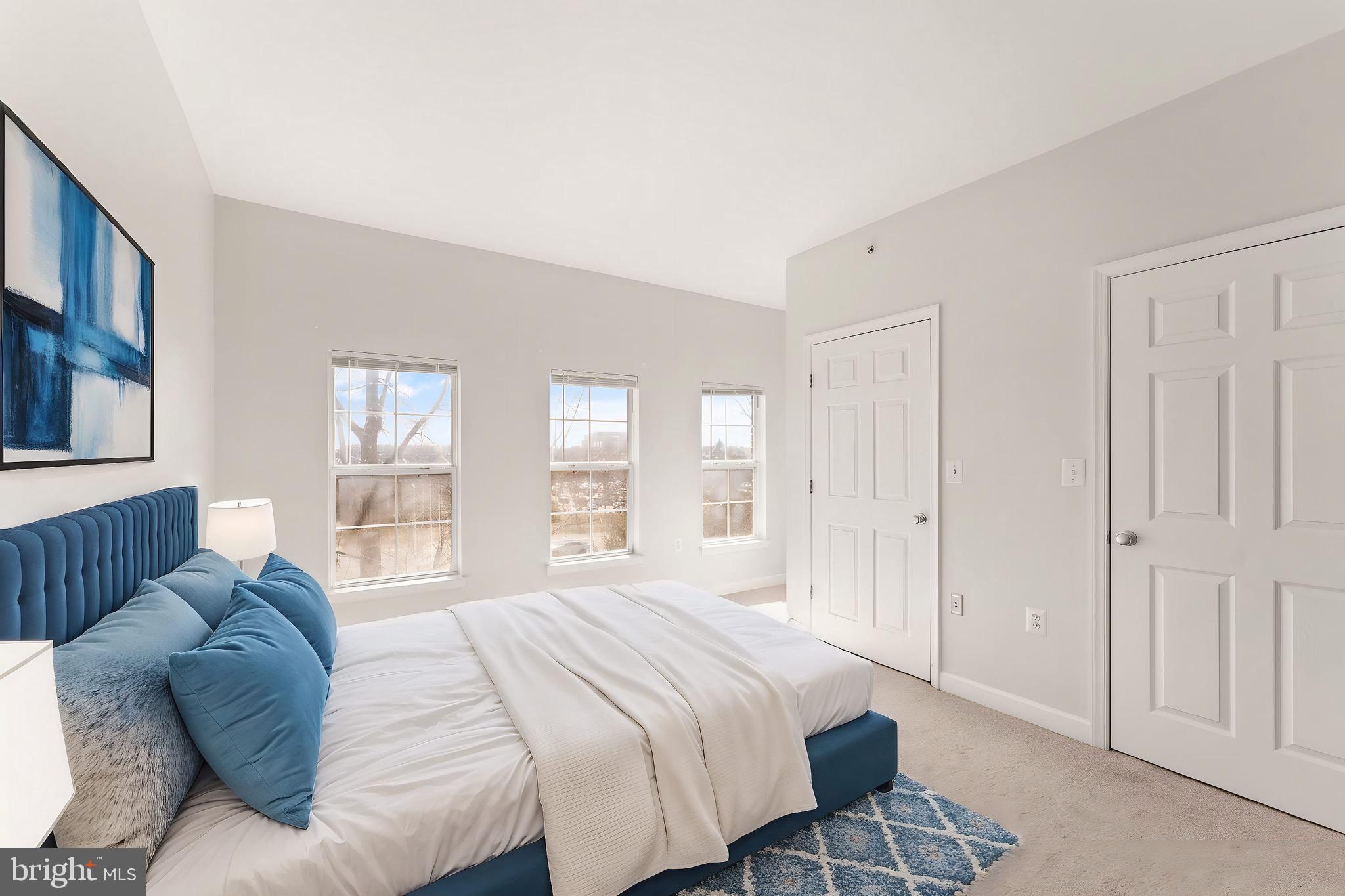 42427 Goldenseal Square Brambleton, VA 20148 - Photo 31 of 52 a spacious bedroom with a bed and a window