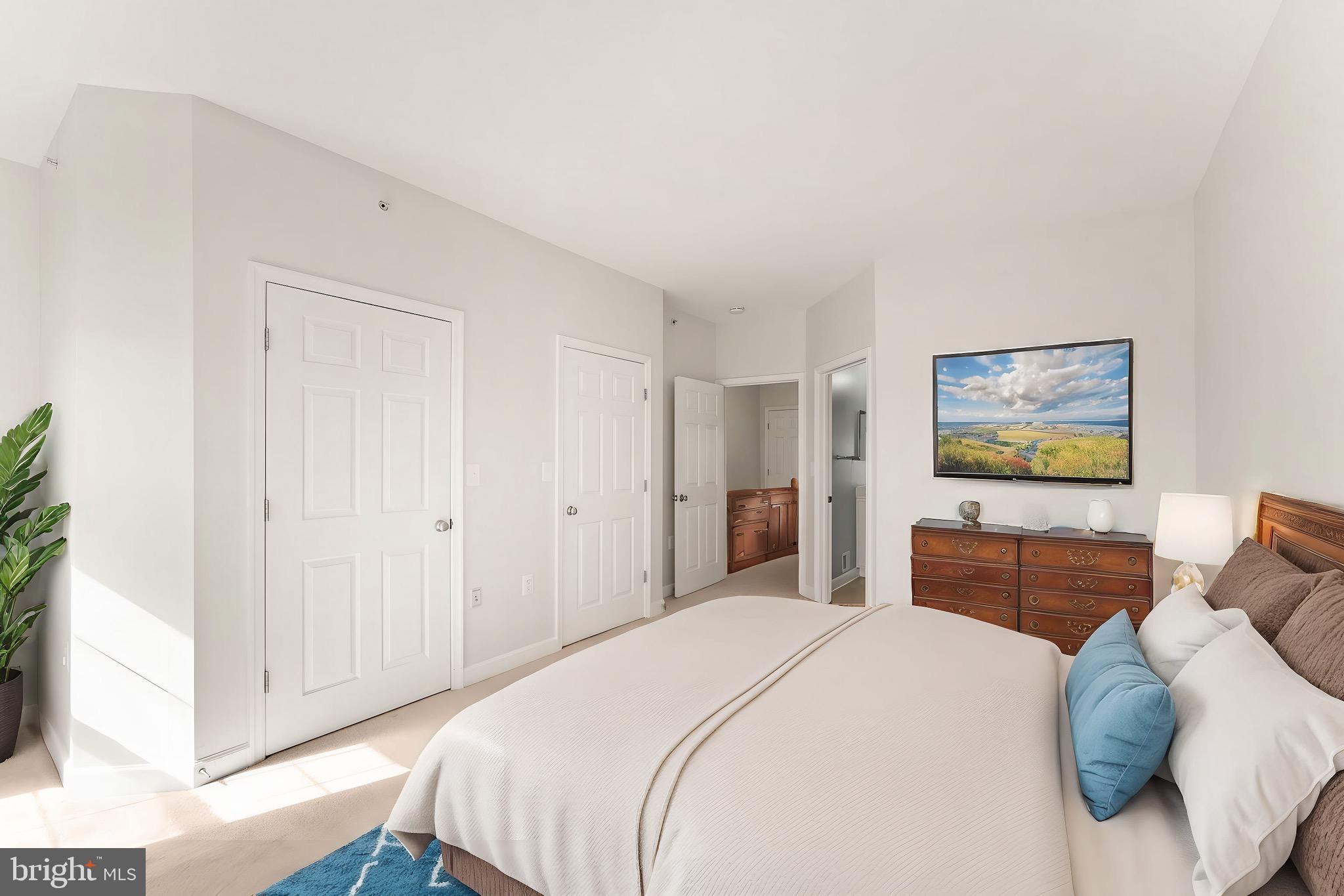 42427 Goldenseal Square Brambleton, VA 20148 - Photo 35 of 52 a bedroom with a bed and a couch