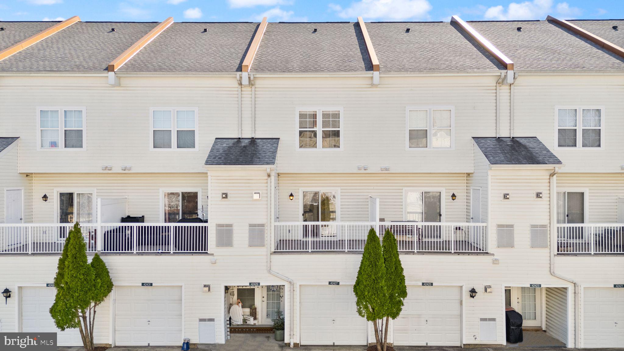 42427 Goldenseal Square Brambleton, VA 20148 - Photo 50 of 52 a very nice looking tall building with a lots of windows