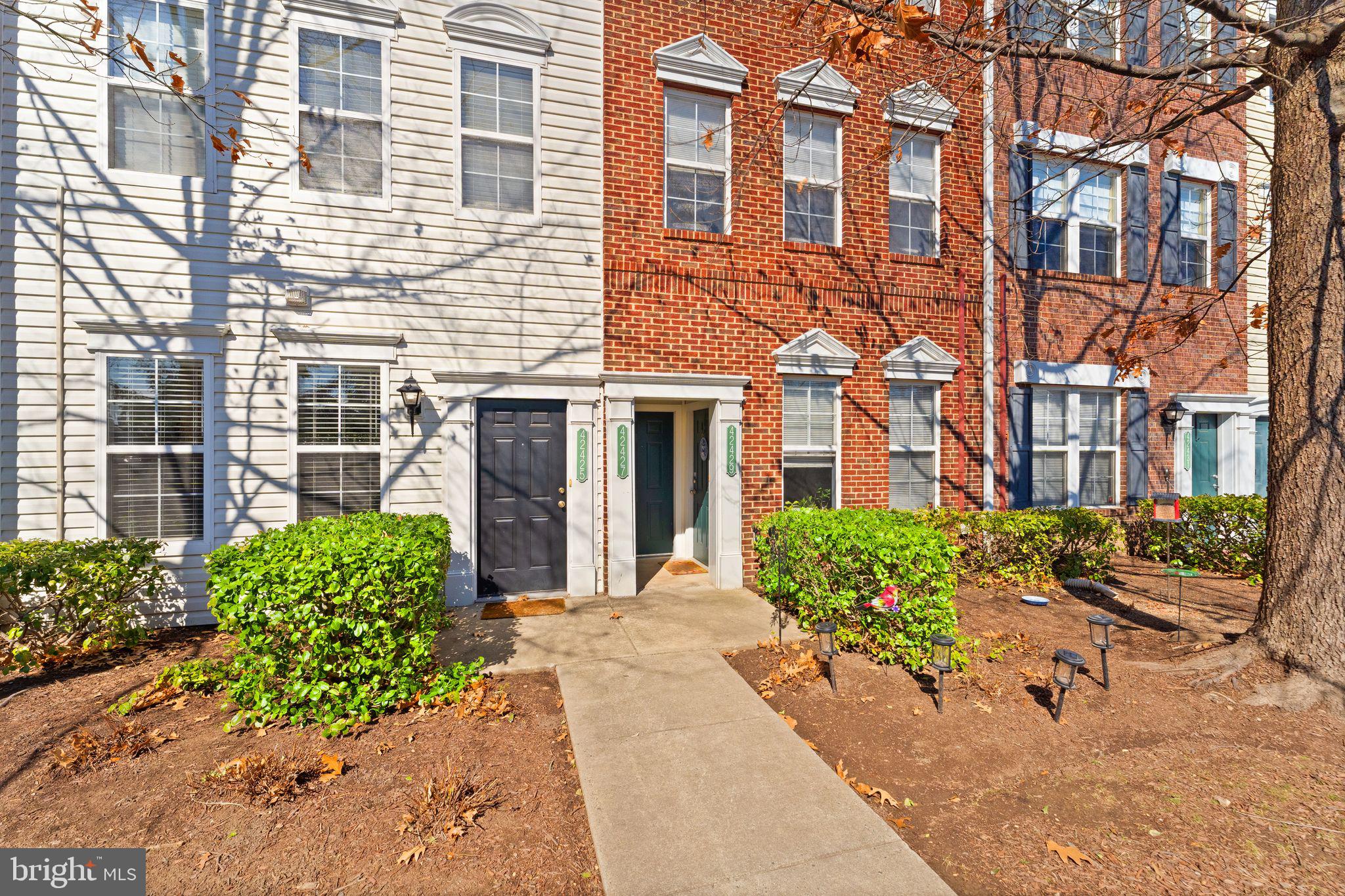 42427 Goldenseal Square Brambleton, VA 20148 - Photo 5 of 52 front view of a brick building