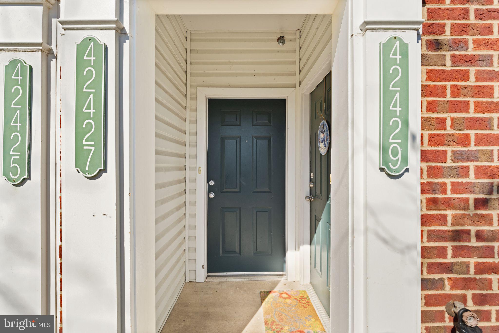 42427 Goldenseal Square Brambleton, VA 20148 - Photo 6 of 52 a view of a hallway with windows and entryway