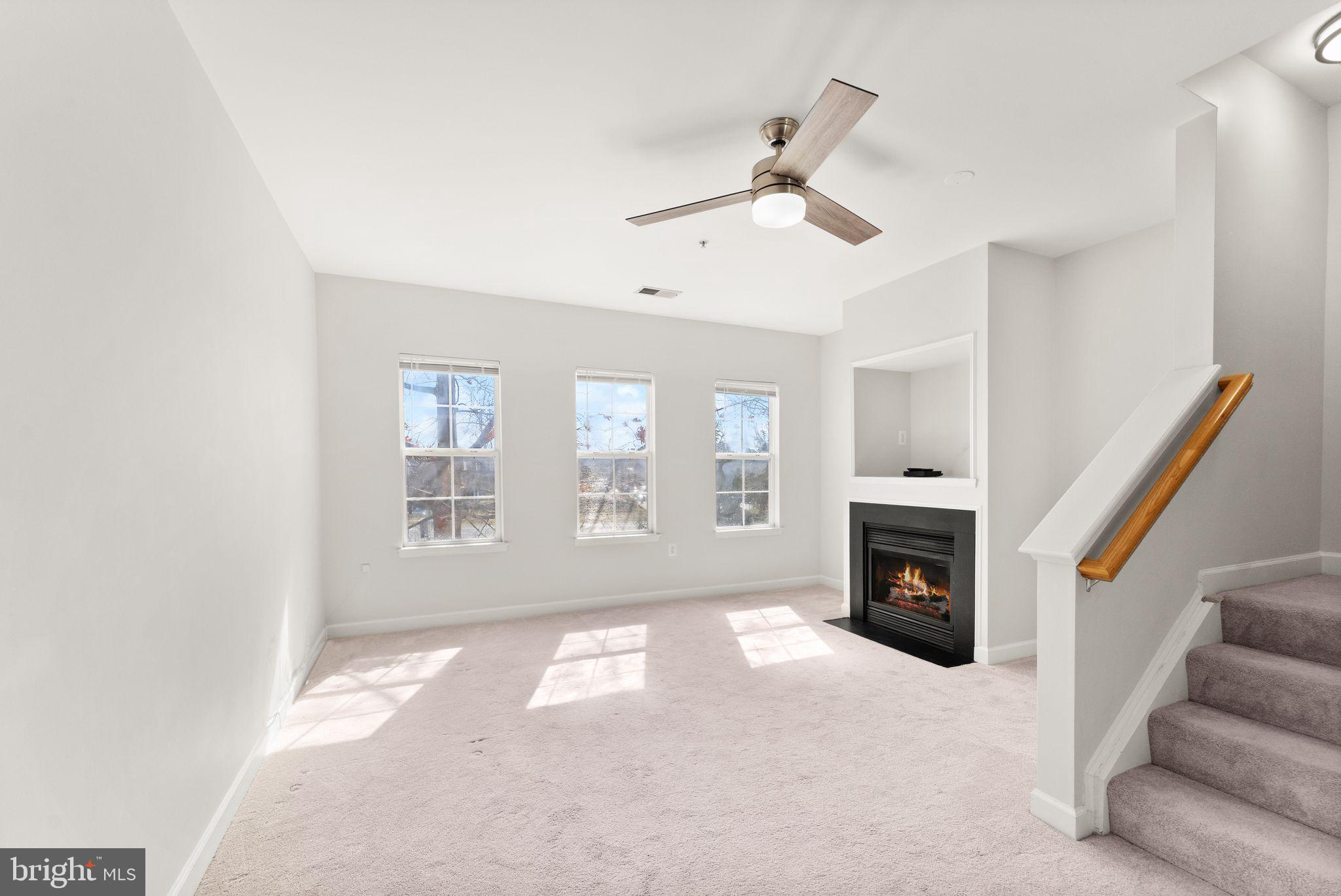 42427 Goldenseal Square Brambleton, VA 20148 - Photo 10 of 52 a view of empty room with a fireplace