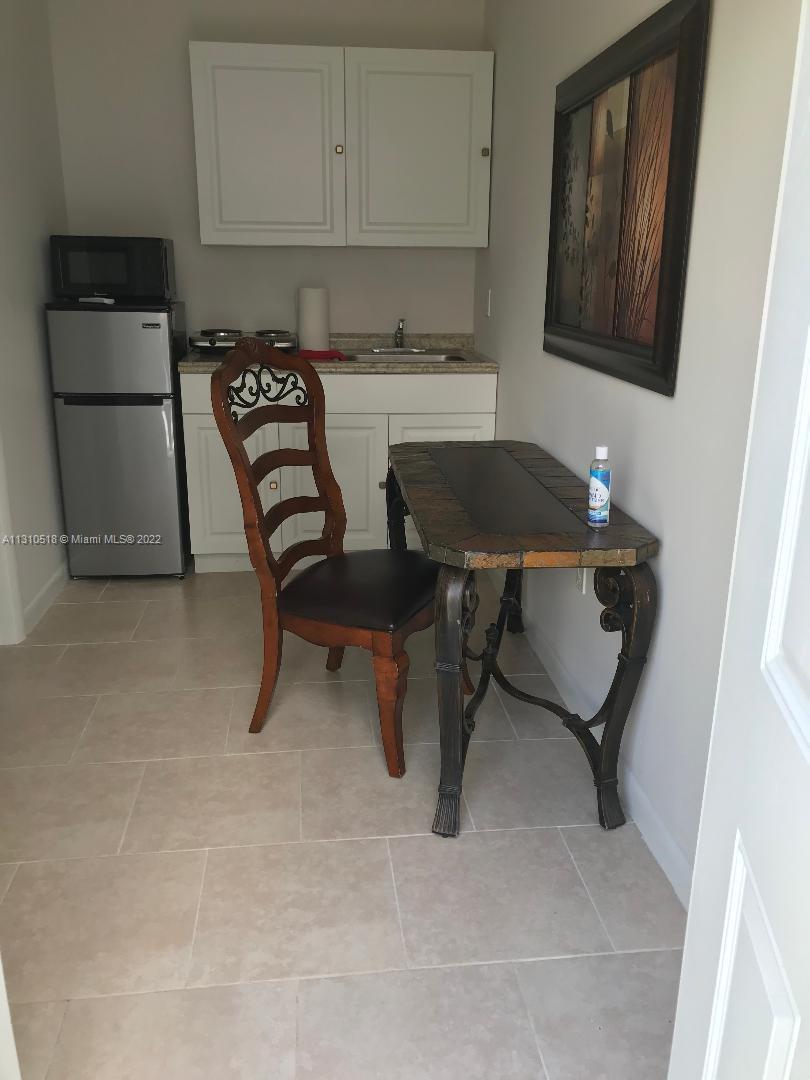 Westchester Miami, FL 33155 - Photo 2 of 8 a workspace with furniture and window