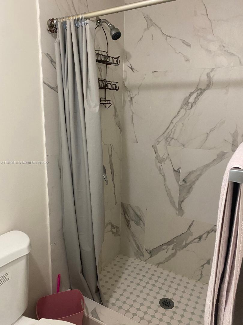 Westchester Miami, FL 33155 - Photo 4 of 8 a bathroom with a shower and a toilet