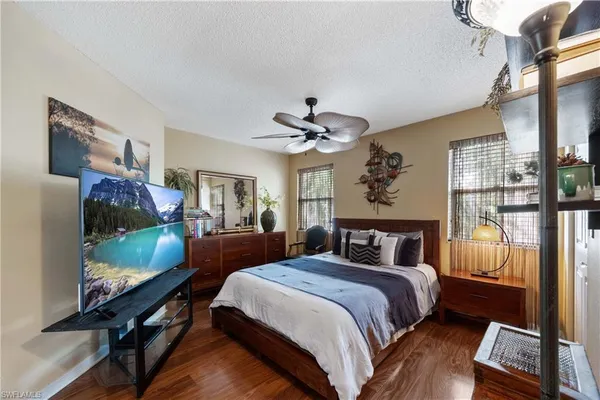 a bedroom with bed and glass door