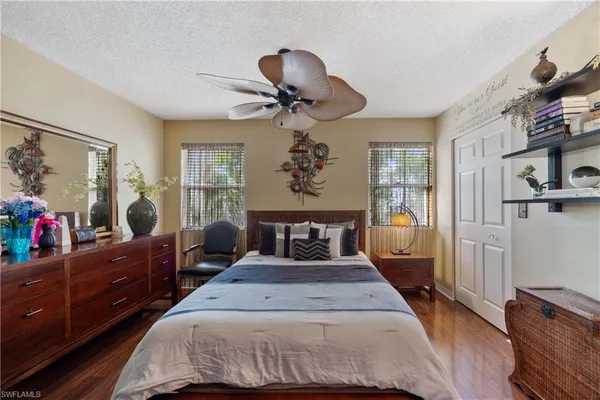 a bed room with a bed and a chandelier